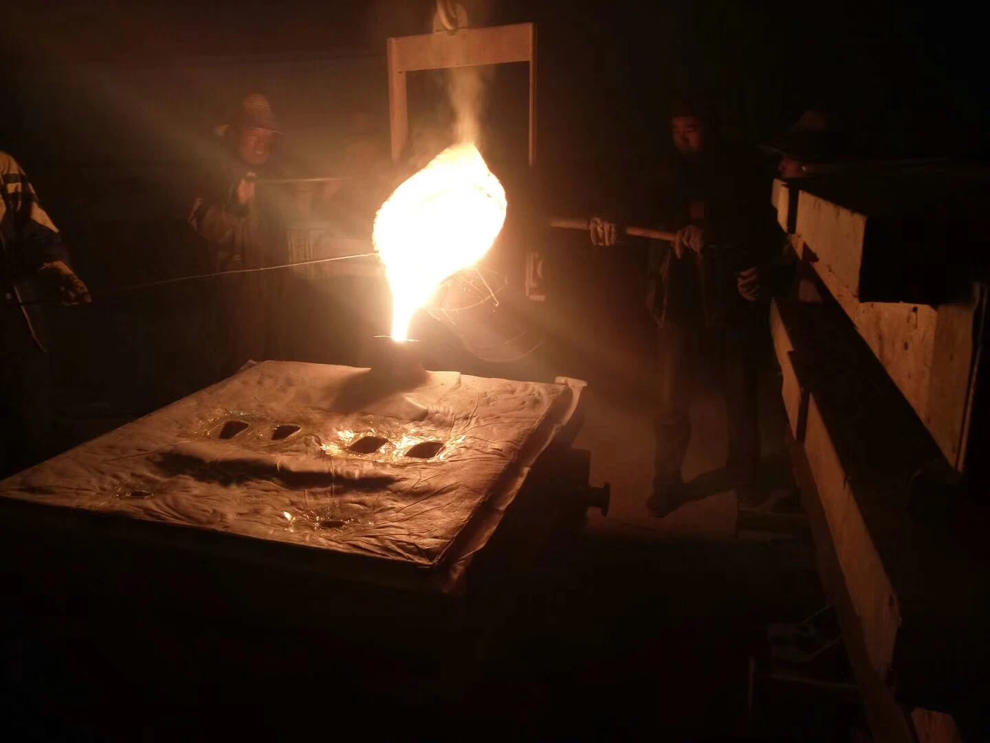 Molten metal being poured in a foundry, showcasing the valve casting process.